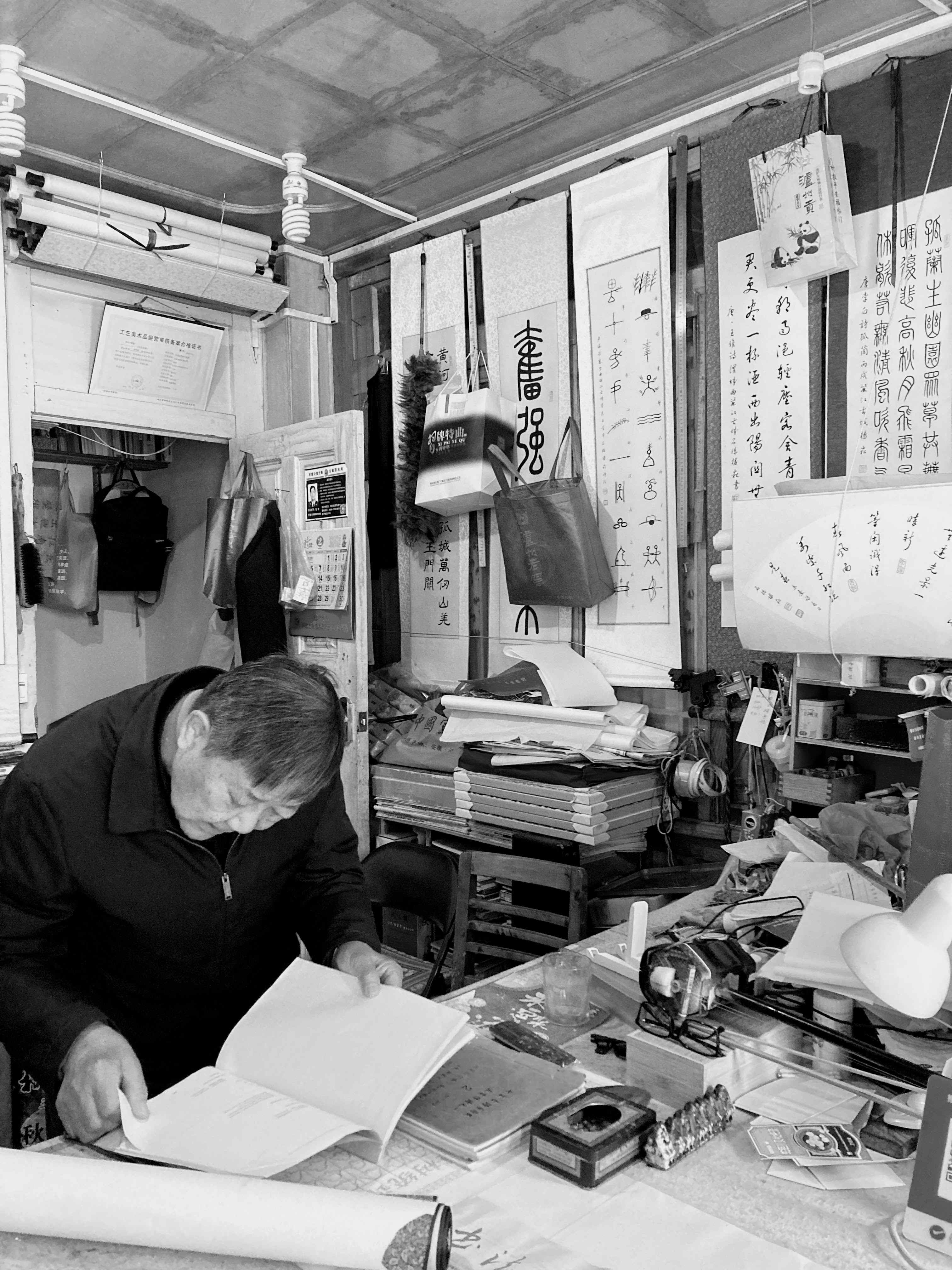 Calligraphy Master in his shop in Lijiang