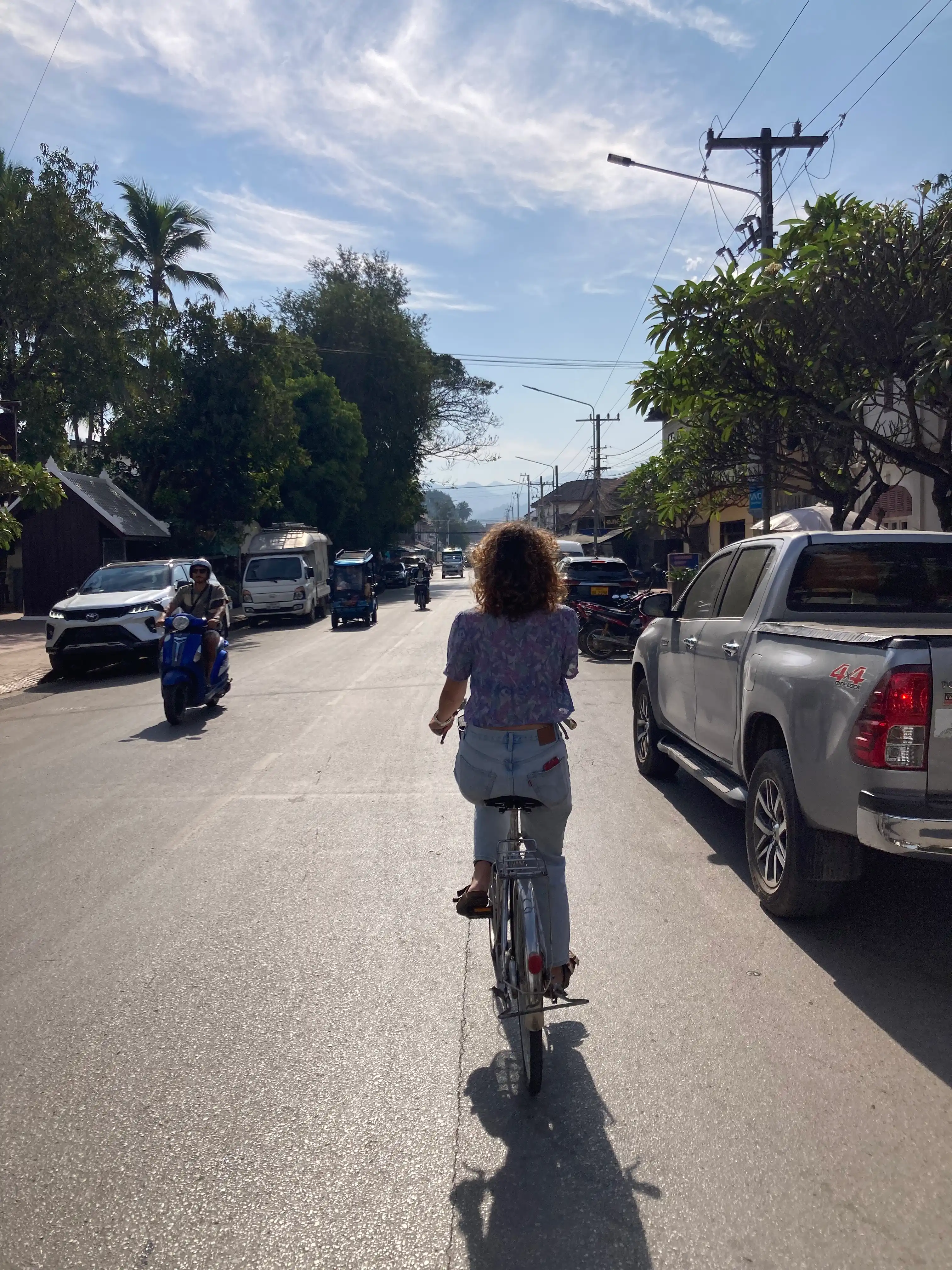 Sofi riding a bike in Luang Prapang