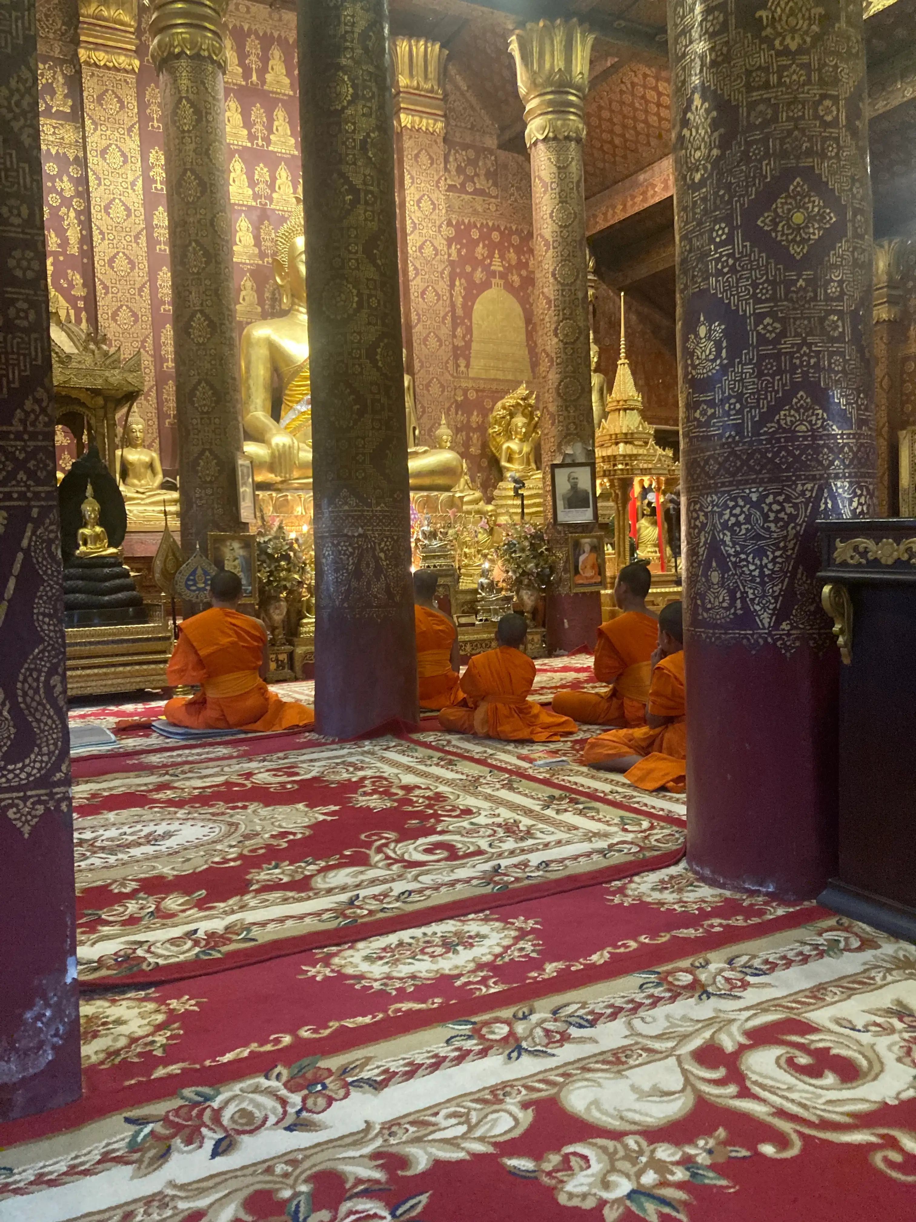 Monks praying in a temple