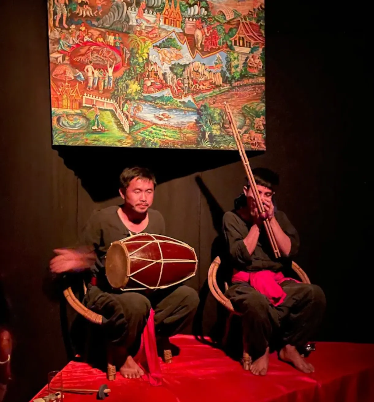 Storyteller playing traditional instruments